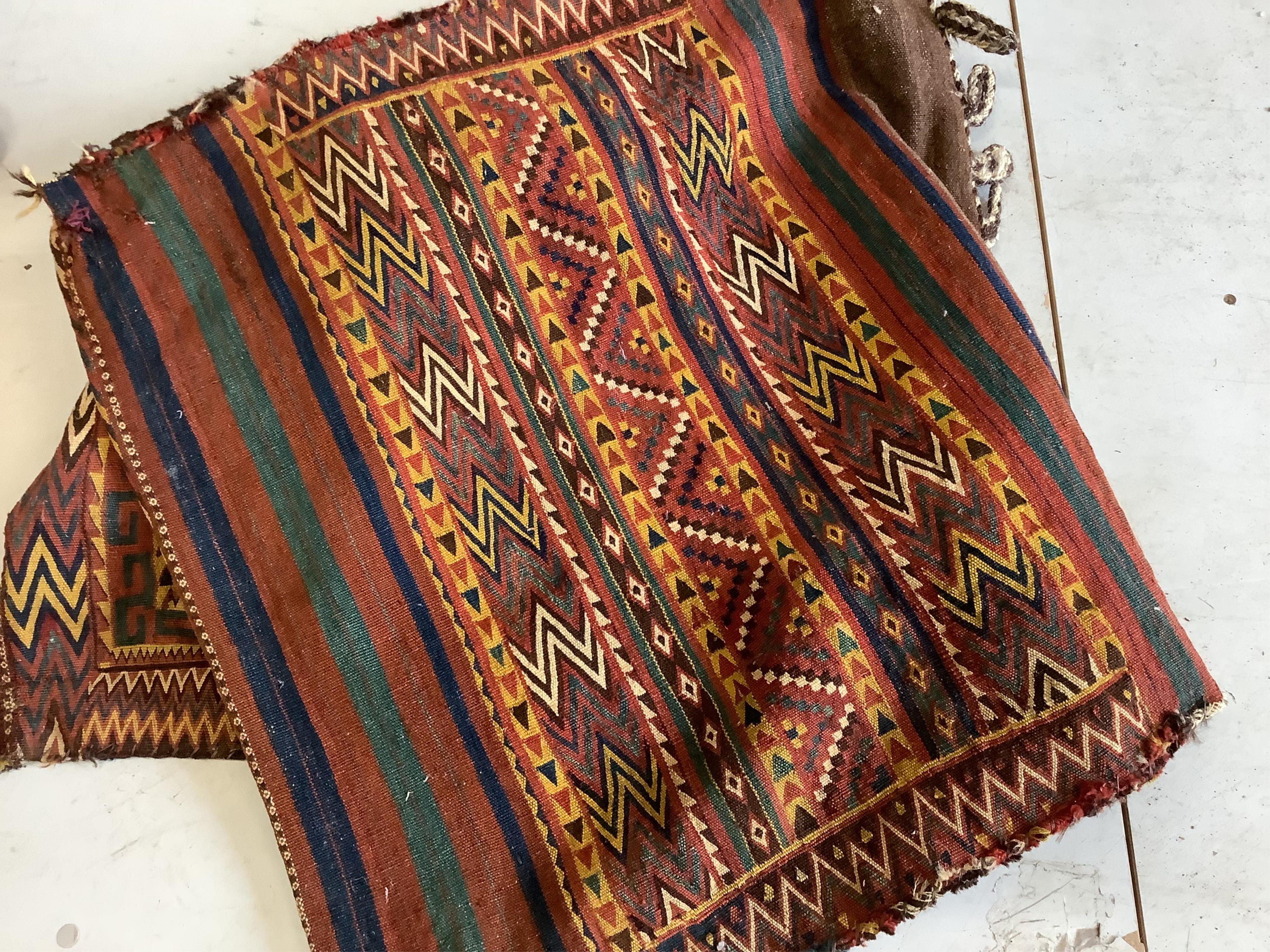 An Afghan Kilim saddlebag, 150 x 76cm. Condition - fair